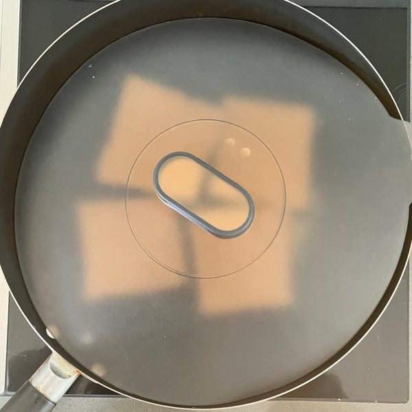 covering the pan with a lid